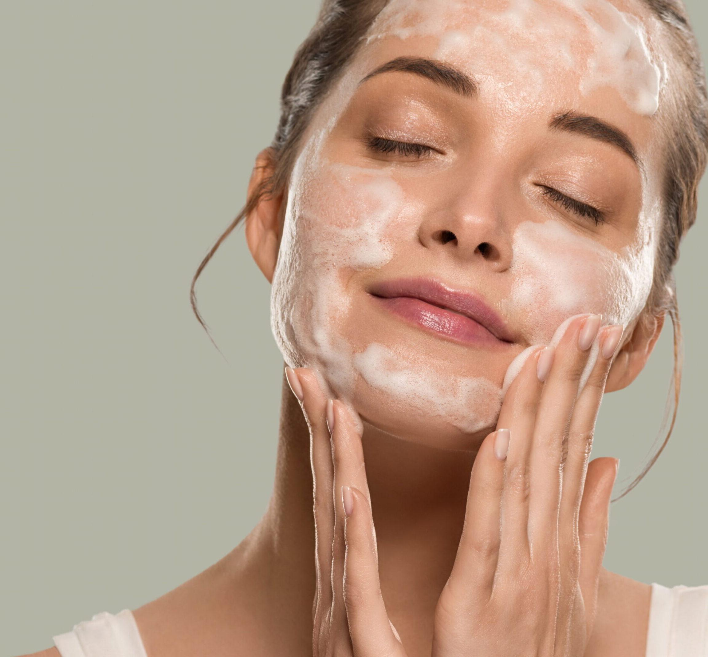 Patient scrubbing face with medical grade products